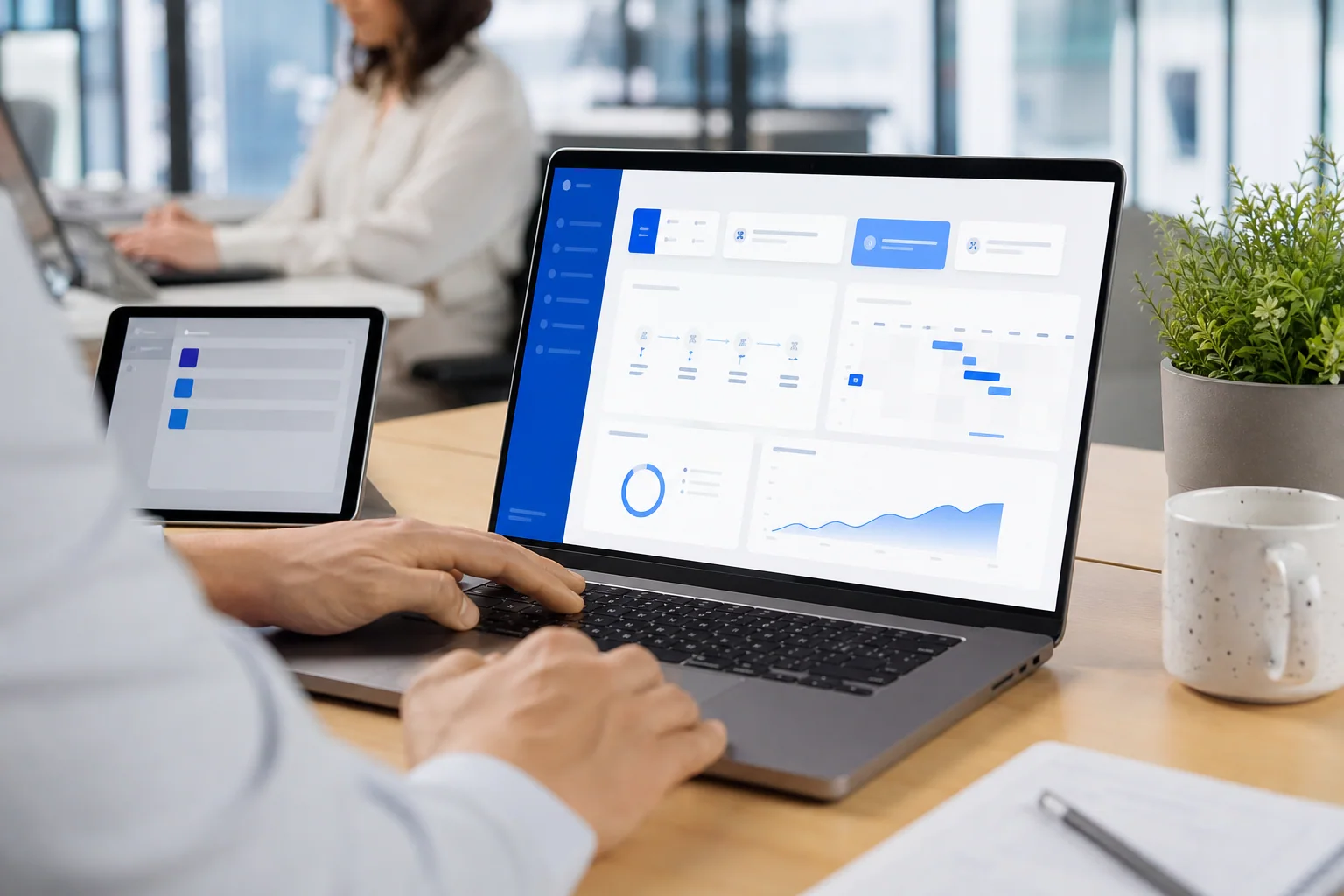 A connected business operations dashboard displayed on a laptop.
